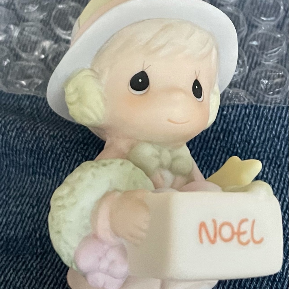 Dusty boy with box of ornaments figurine